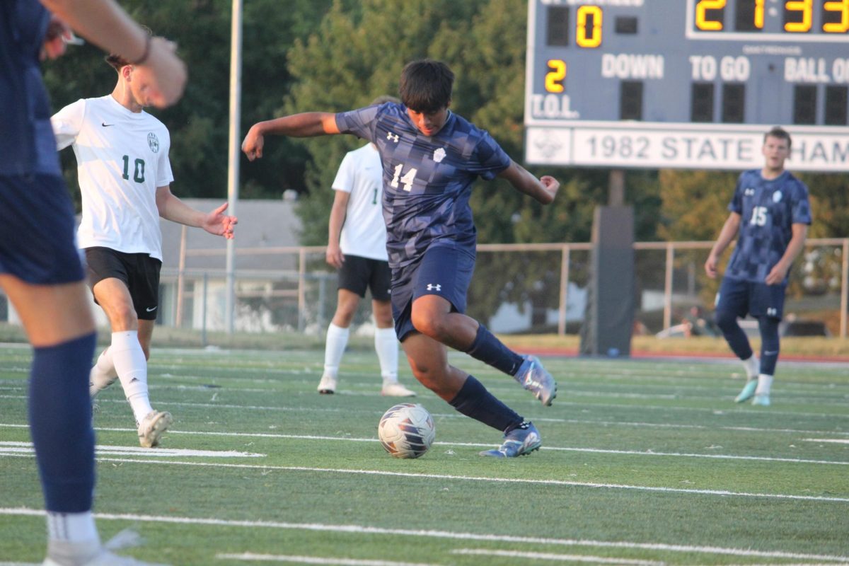 Anthony Cortes-Lopez fights to keep the ball from the opposing team.