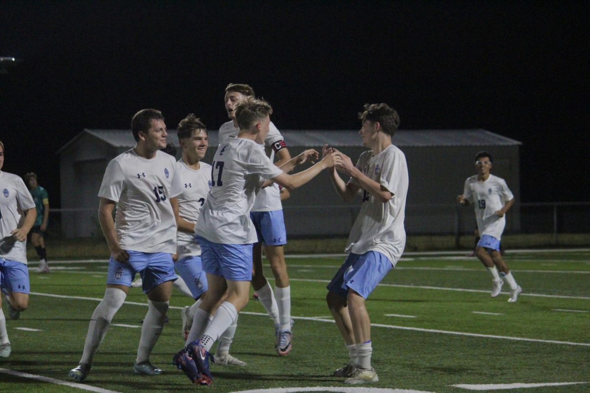 Sam James and Greyson Guerra celebrate a goal. 