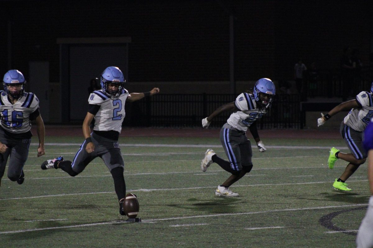 Jack Nemens kicks the ball.
