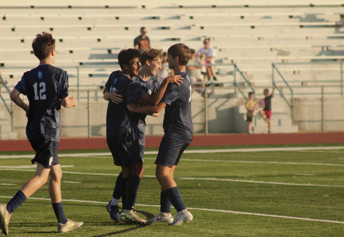 Julian DeAnda, Sam James, Dean Balog celebrate a goal.
