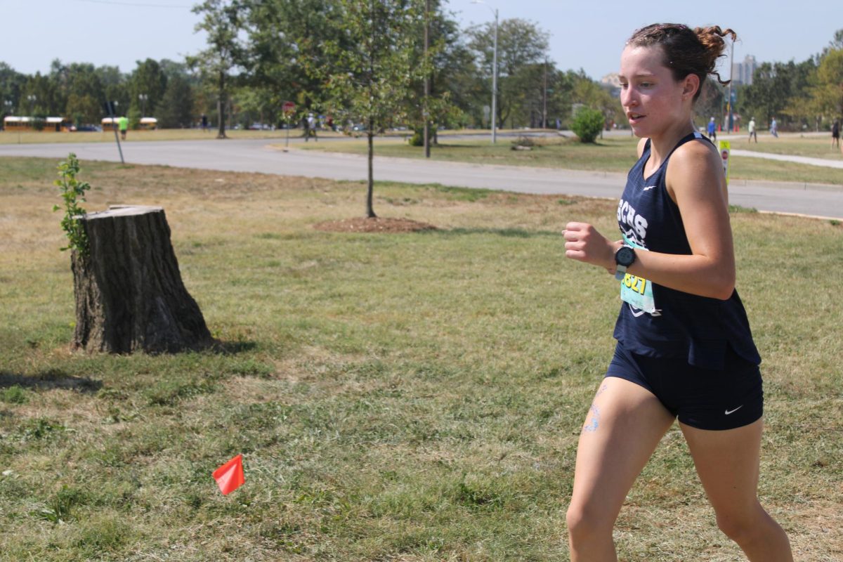 Meredith Case running at the Forest Park XC Festival on 9/13/25
