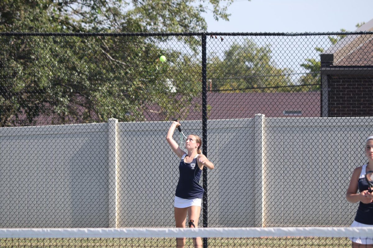 Matalyn Basler serves the ball.