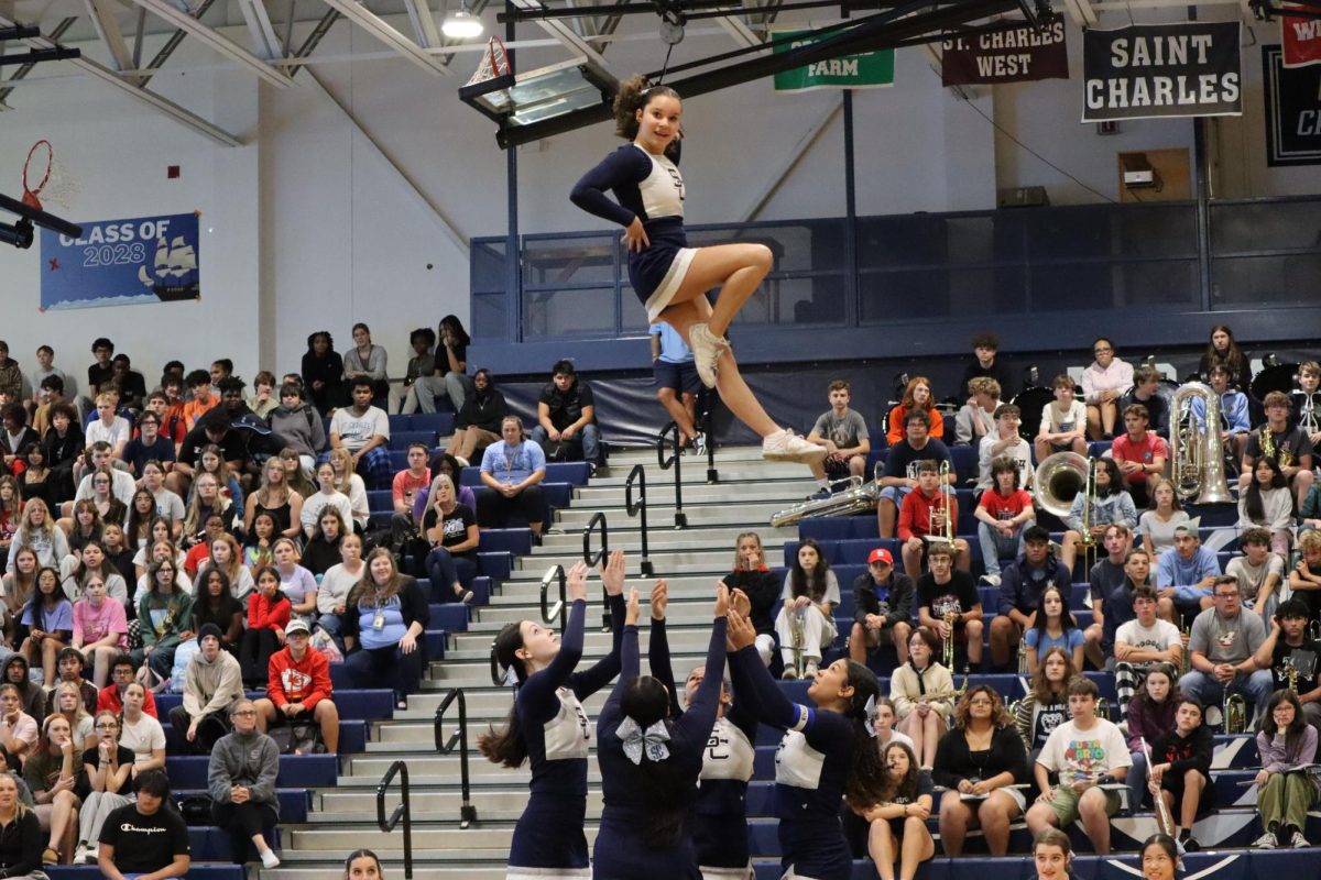 Paisley McCadney poses in the air while doing a cradle.