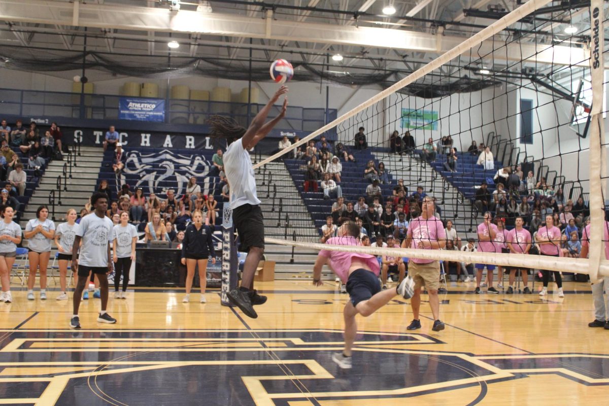 Kenneth Minion goes up to block Coach Dill.