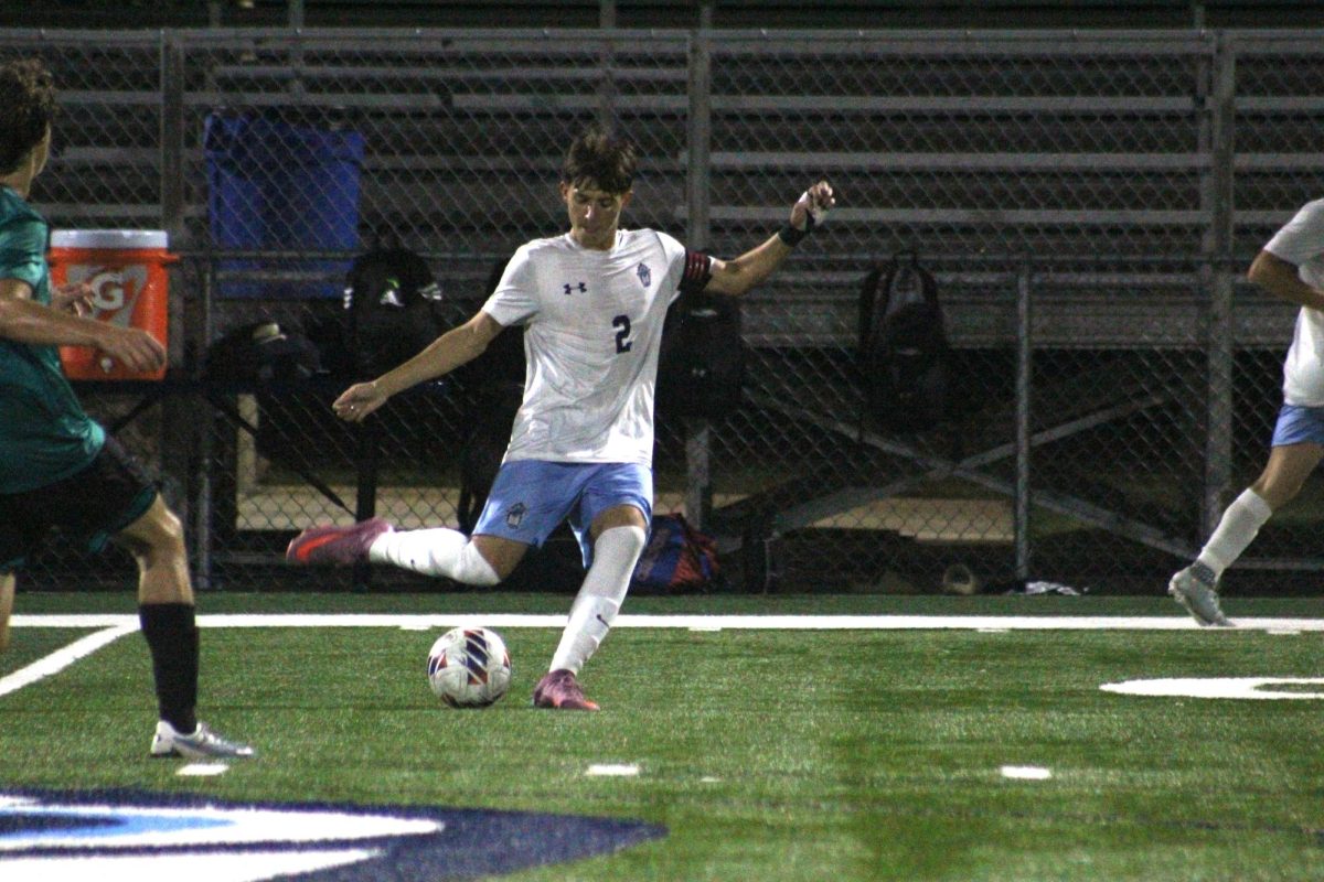 Jack Nemens kicking the ball.