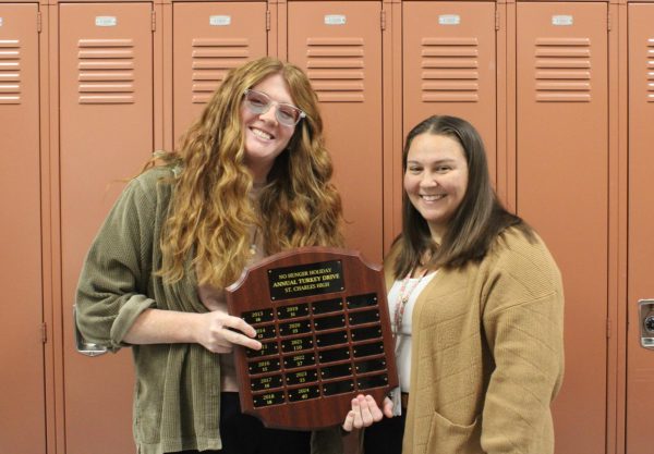 Daniele Munzer and Elizabeth Laley show off Turkey Drive plaque. (Malia Kummer)