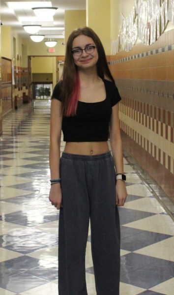 Student Lola Sasso poses for an outfit picture.