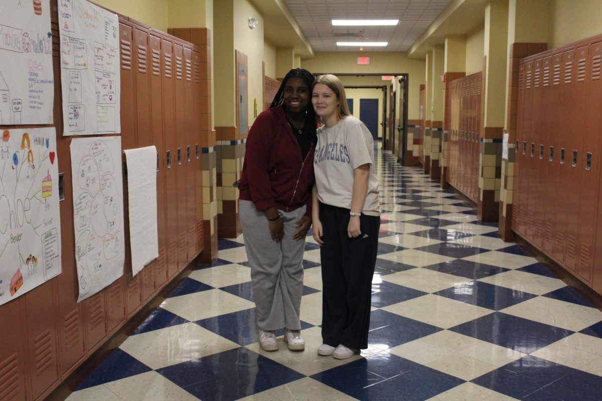 Student's Gabrielle Hanson and Taylin Snipes pose for an outfit picture.