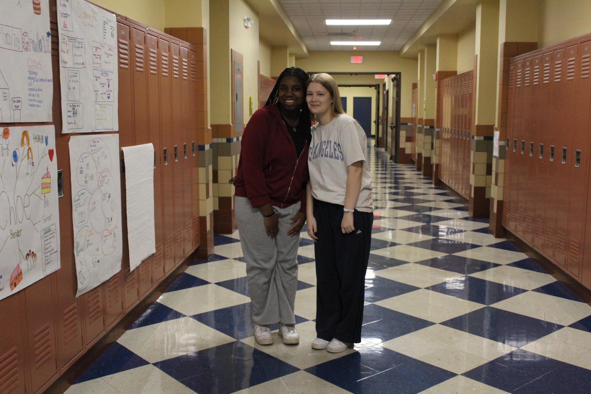 Student's Gabrielle Hanson and Taylin Snipes pose for an outfit picture.