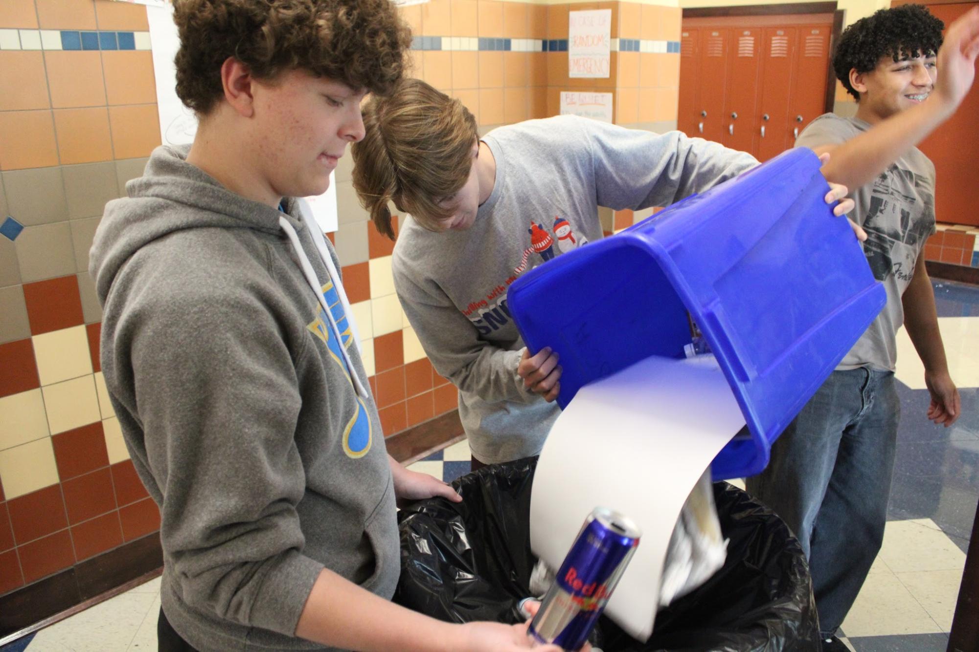 Sorting out the recyclables, Emmett Bibb helps organize aluminum cans out of the bin to be crushed on Nov. 5. Key Club crushes these cans down and are exchanged for money at the local recycling center.