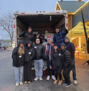 Members pose for a photo Infront of toy truck at "The Boatload of Toys." (Wendy Kirchhofer)