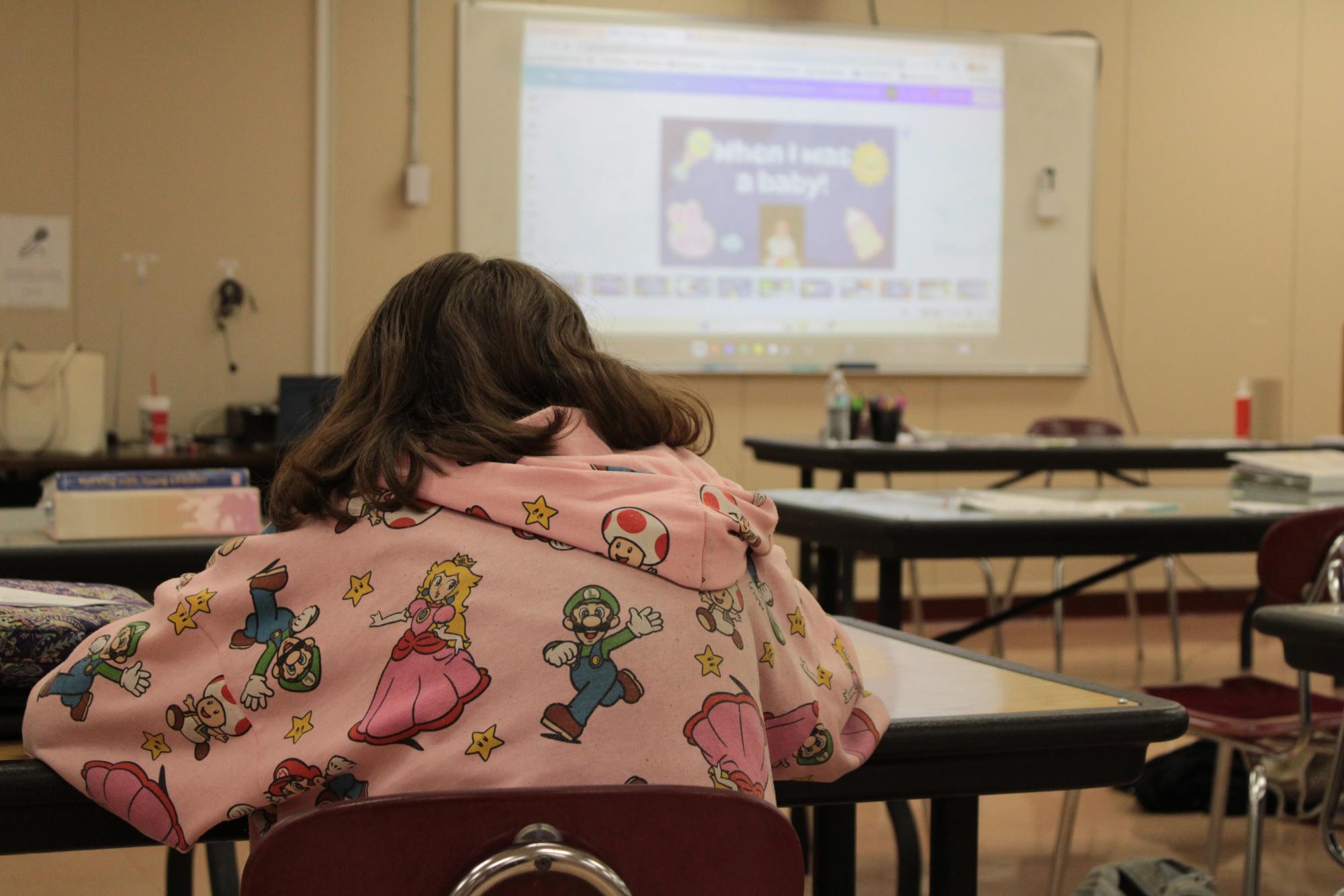 Student in multi-purpose room for class (Early childhood)