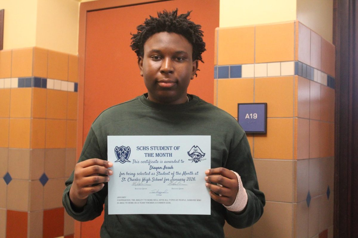 Diayan Issah holds his student of the month certificate