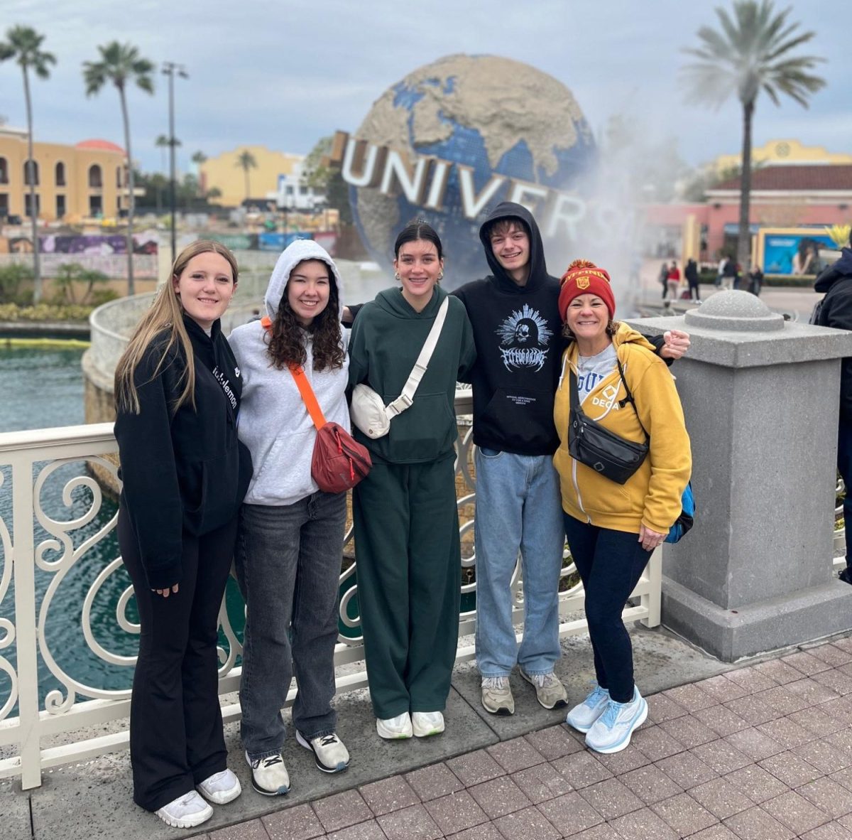 Members pose for a photo Infront of Universal globe. (Judith Simmons)