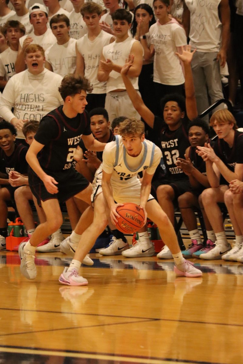 Will House looks for a teammate to pass the basketball to.