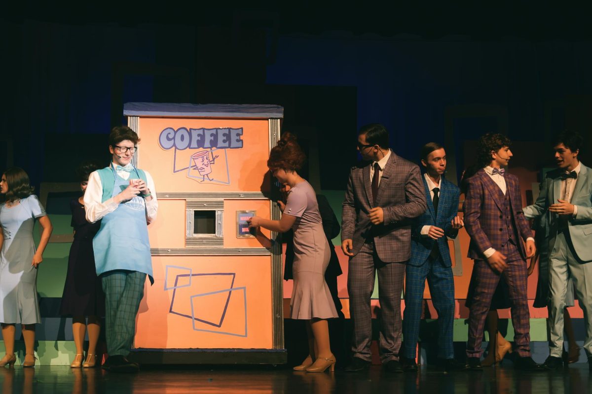 Charlotte Kulma tries to get a cup of coffee.