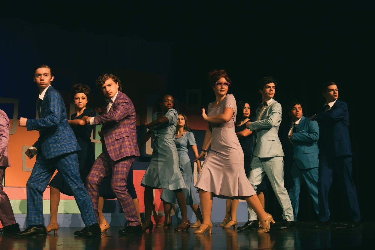 The employees at World Wide Wickets dance together after finding out there isn't anymore coffee.