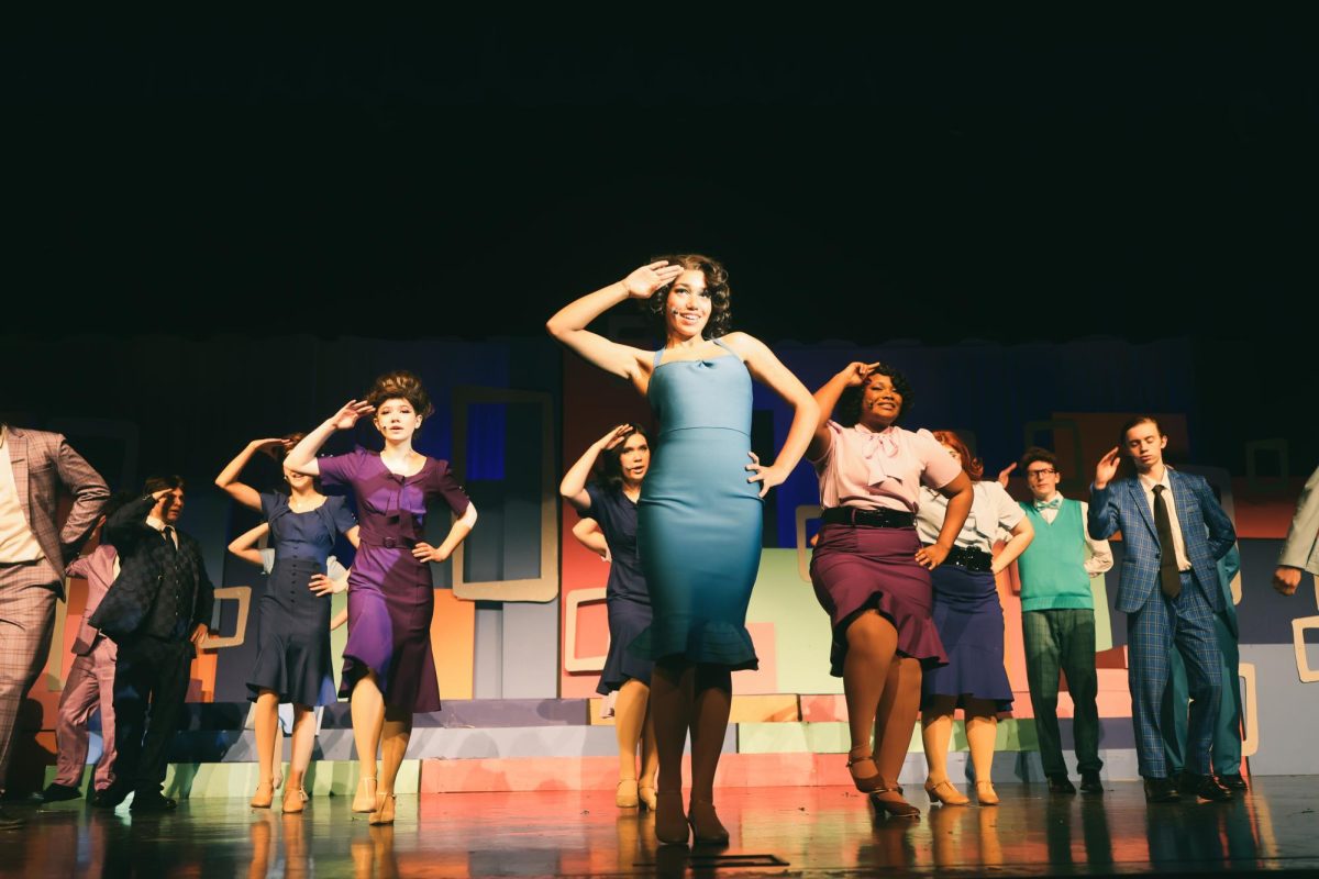 Everybody on stage poses at the end of a dance.