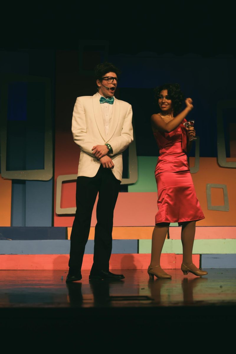 Daniel Waters talks to Isabella Lathan about the party.