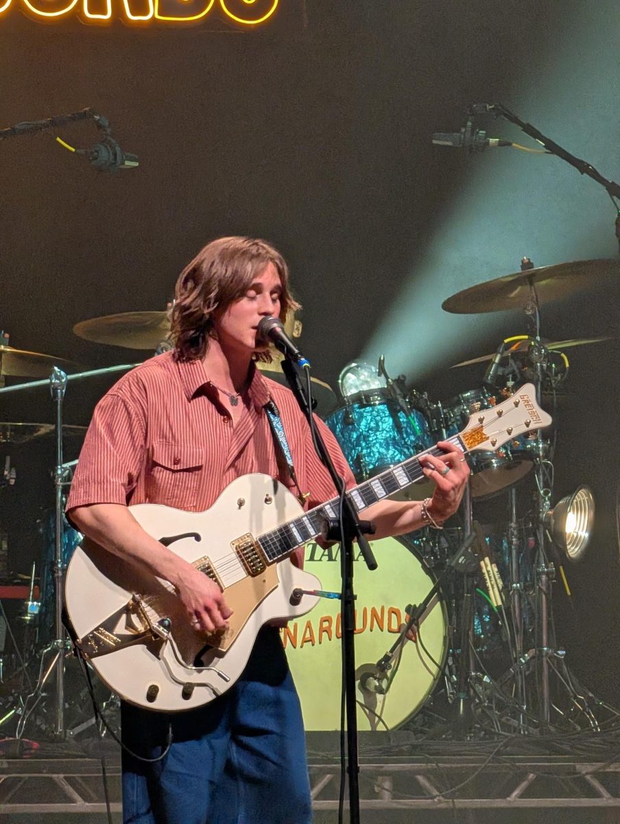 Axel Ellis sings and plays the guitar at The Pageant.