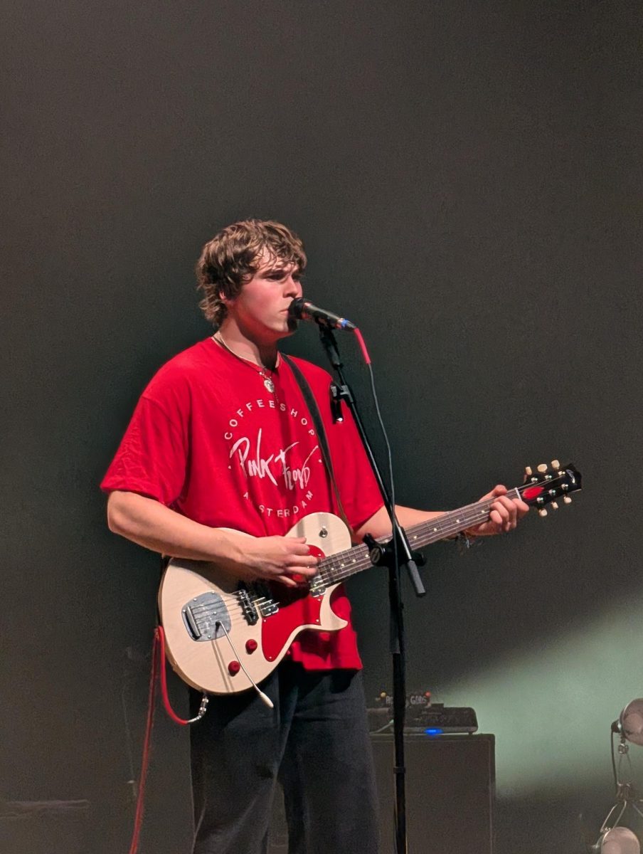 William Lipton sings and plays the guitar during The Runarounds concert on Feb. 4.