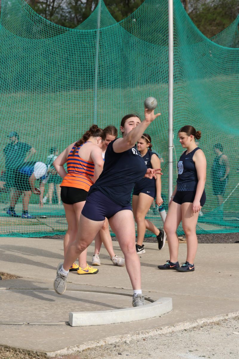 McKenzie Brauch throws shotput at the St. Dominic meet on March 25.