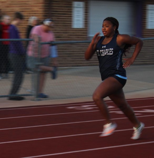 Sophomore Preslie Philogene runs at her track meet.