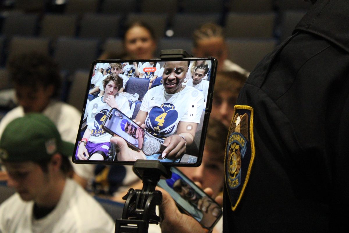School Resource Officer Jason Love speaks to his brother over FaceTime.