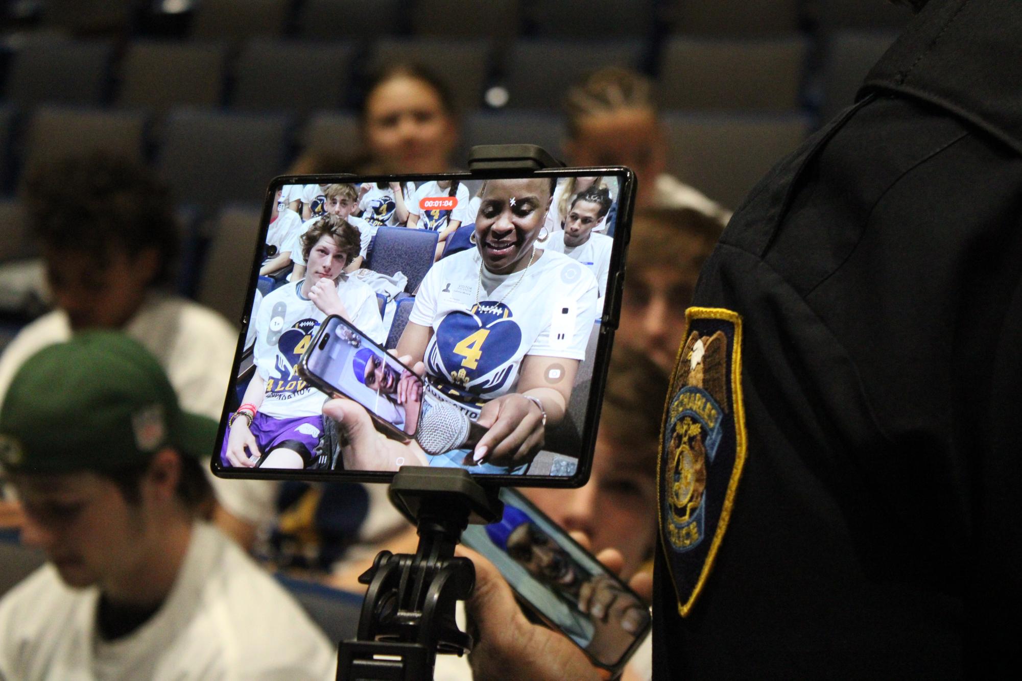 School Resource Officer Jason Love speaks to his brother over FaceTime.