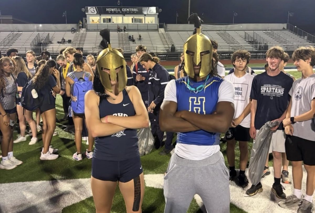 Grace Basler being awarded the spartan helmet after winning the Pentathlon event at the Francis Howell Central meet. (courtesy @schs.txf)