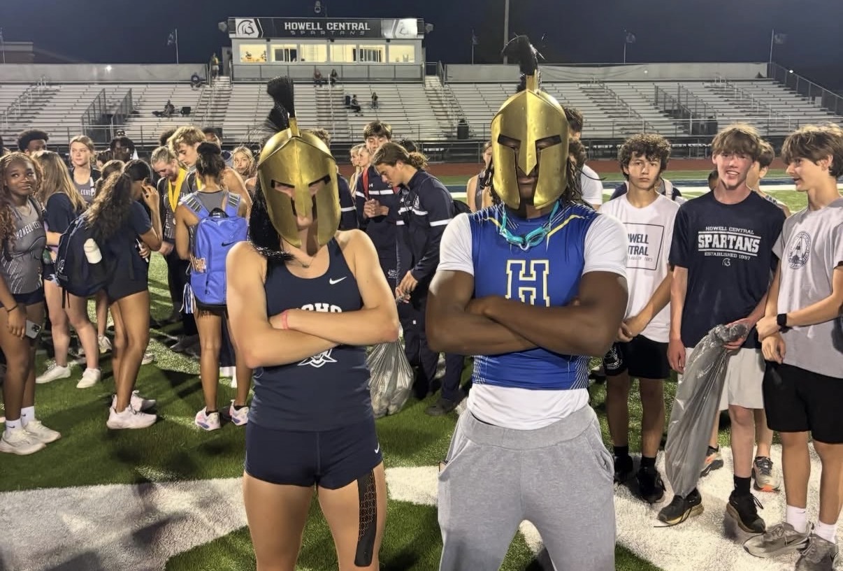 Grace Basler being awarded the spartan helmet after winning the Pentathlon event at the Francis Howell Central meet. (courtesy @schs.txf)