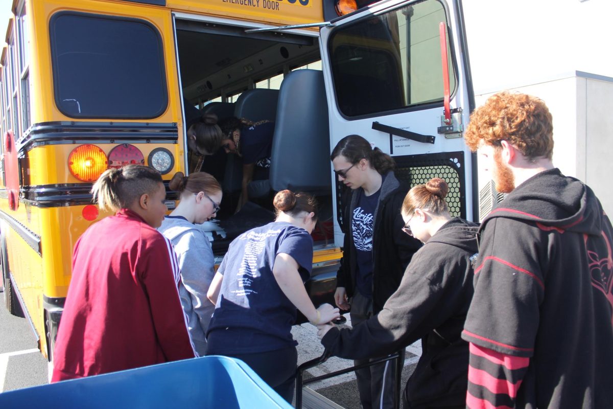St. Charles United Winter Guard unloading their bus.