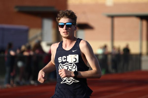 Will House runs at a track meet.