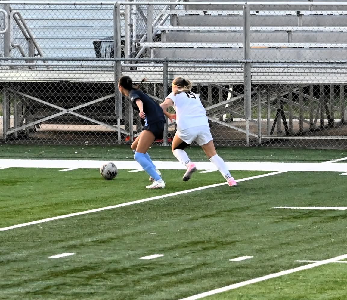 Davita Gingras shielding the ball in the varsity girls soccer game against Francis Howell North on March 20.  (courtesy @SCHSactivities) 