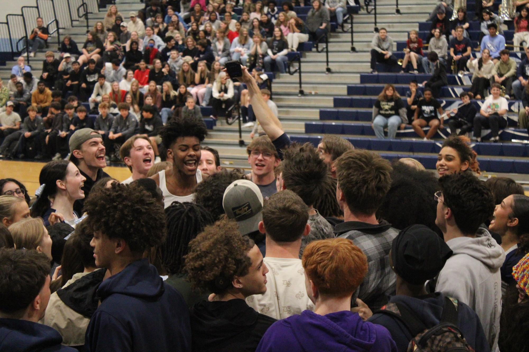 Seniors yelling for class chants during Turkey Tip-off Assembly.