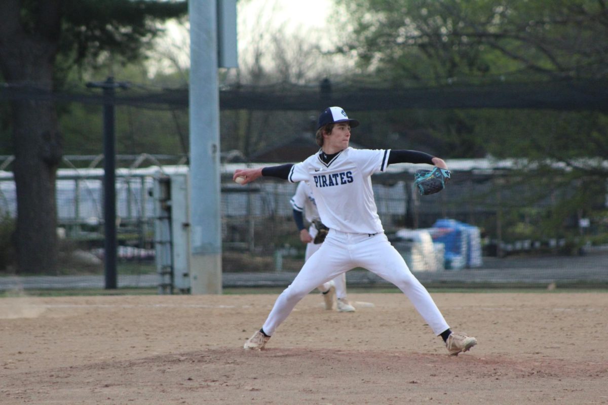 Colton Hadler pitches the ball.