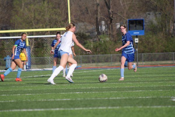 Rylan Orrick goes to take the ball from the other team.